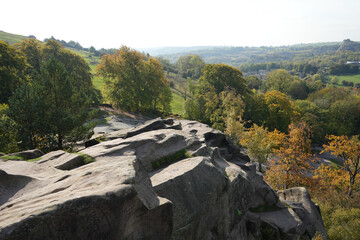 Scenic View From Black Rocks Showing Rugged Gritstone Formations, Vibrant Autumn Trees, And The Expansive Cromford Valley In Derbyshire, England.