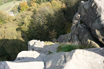 Scenic View Looking Down From The Rocky Black Rocks Over An Autumn Valley With Colourful Trees And Distant Houses In Cromford, Derbyshire, England