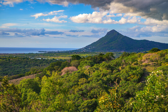 Scenic view of La Tourelle du Tamarin, also known simply as La Tourelle, a prominent mountain on the west coast of Mauritius, surrounded by Indian Ocean, tropical forest and coastal plains.