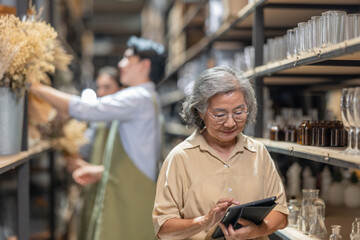 Mother and Family Business Owner Teaching About Material Production and Recycling