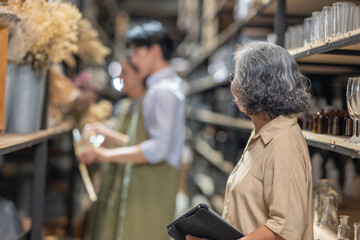 Mother and Family Business Owner Teaching About Material Production and Recycling