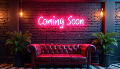 Bright pink neon sign spells Coming Soon above plush red leather sofa. Brick wall background with potted plants and warm light bulbs. Lounge atmosphere.