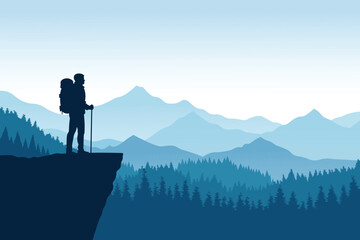 Obraz premium Hiker standing on a cliff overlooking a mountain range