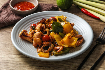 Roasted octopus with vegetables and oil © Andrei Starostin