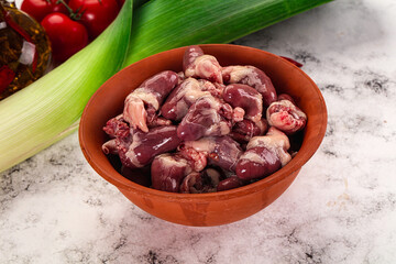 Raw chicken hearts in the bowl