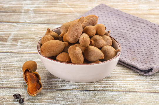 Tropical exotic Tamarind fruit heap