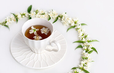 Jasmine flower tea in white cup