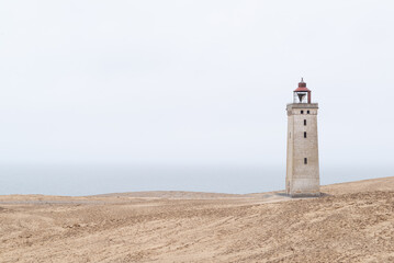 Rubjerg Knude lighthouse located on a sand dune in Denmark.