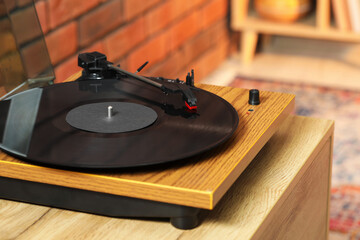Obraz premium Modern turntable with vinyl record at home, closeup