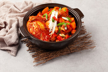 닭볶음탕은 닭고기를 토막 쳐서 양념과 물을 넣고 끓인 음식. 
Dakbokkeumtang is a dish made by boiling chicken pieces with seasoning and water.

