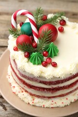 Tasty cake with Christmas decor on wooden table, closeup