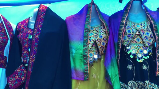 Traditional Pakistani Sindhi dresses, Traditional national dresses are on market in Peshawar city, Pakistan. Pashtun style. Pashtun fashion. Bazaar in Peshawar city, Pakistan. Pakistani fair,