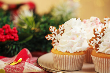 Festive cupcakes with cookies on table, closeup. Christmas treat