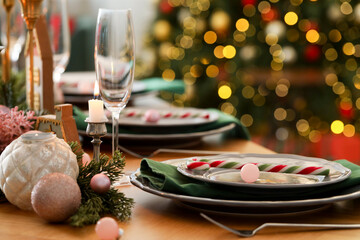 Festive table setting with Christmas decor at home, closeup