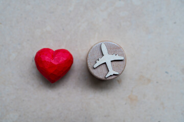 Wellness tourism insurance airplane red heart travel healthcare wellness tourism