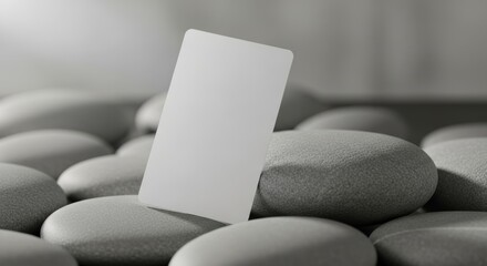 Minimalist Business Card Mockup on Smooth Gray Stones.