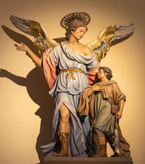 CAVA DE TIRRENI, ITALY - OCTOBER 7, 2025:The carved polychrome statue of Guardian angel in the church Chiesa di San Francesco probably by unknown artist.