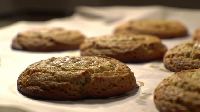 Freshly Baked Cookies on Parchment Paper - A Delicious Treat.