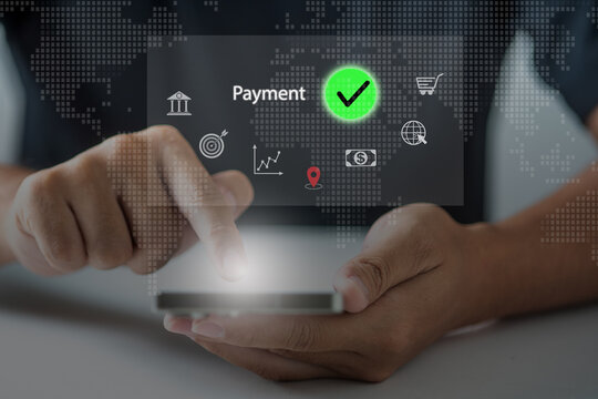 Close-up hand using mobile phone for secure online payment with virtual banking and finance icons. Fintech and digital transaction concept for e-commerce and global finance.