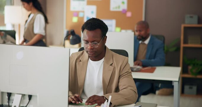 Computer, creative and man in office for publishing, online article or research for website content. Coworking, magazine agency and person on pc for proofreading report, copywriting or editing review