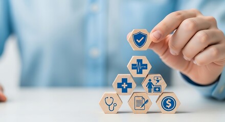 Hand arranging wooden blocks with healthcare medical icon for health insurance