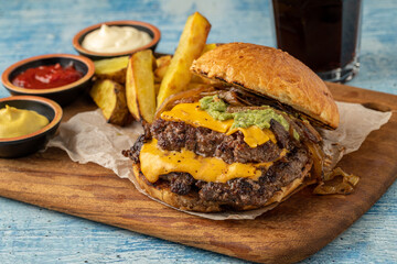 Smash burger with cheddar cheese and caramelized onions, served with fries