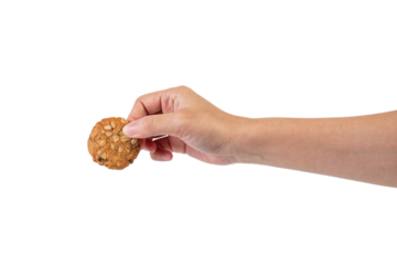 Cookies sprinkled with grains in hand on transparent background