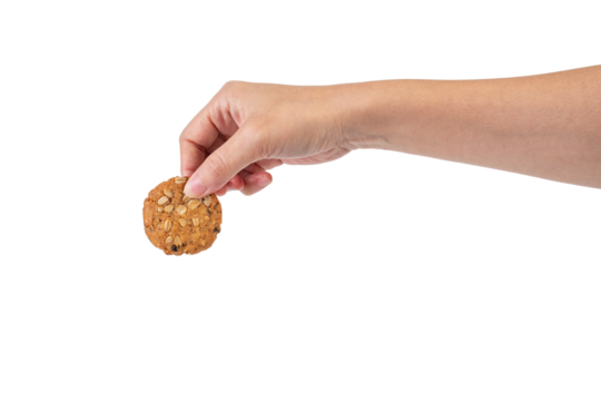 Cookies sprinkled with grains in hand on transparent background - Powered by Adobe