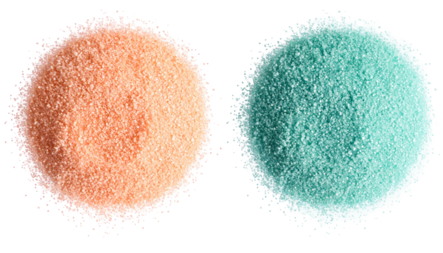 Two circular piles of fine, granular material in contrasting colors against black