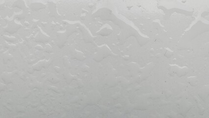 Macro Close-up of Clear Water Droplets on White Surface Texture