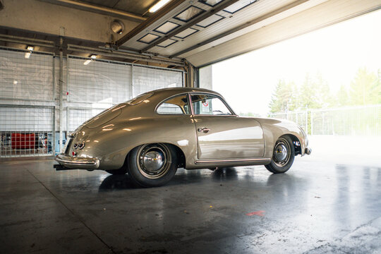 Brno, Czech Republic - October 10, 2025: Rare historic sports car Porsche 356 from the 1950s. Luxury old German car stands in the garage.
