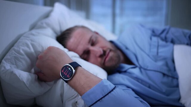 Man Monitoring Sleep Activity With Fitness Tracker Smartwatch