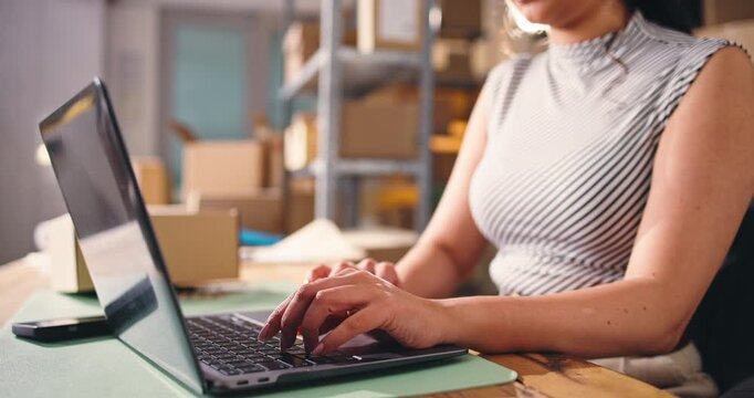 Small business, hands or laptop in warehouse for ecommerce, review site or answer order query. Online shopping, supply chain or entrepreneur woman with pc, typing supplier email or startup planning