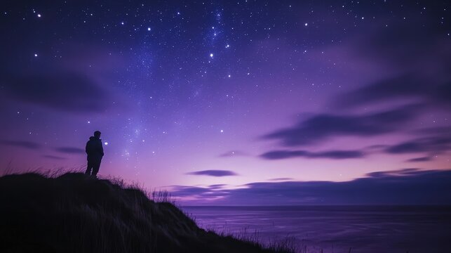 A person gazes at a starry night sky over the sea, surrounded by a purple hue. Nature shines bright with stars and clouds in view.