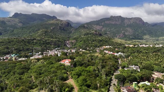 Aerial panoramic view of Courtallam falls (Kuttalam) town nestled in the foothills of the Western Ghats, Tamil Nadu, South India.