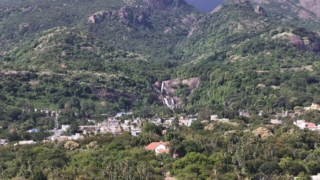 Courtallam waterfalls, Tamil nadu, the &ldquo;Spa of South India,&rdquo; captured from above &mdash; forested hills, gushing waterfalls, and vibrant town colors at the foot of the Western Ghats.