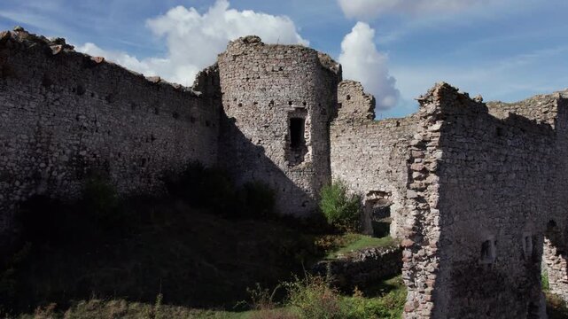 Aerial drone of the interior of Bjelaj Fortress near Bosanski Petrovac, Bosnia and Herzegovina. The medieval stone walls and towers reveal the fortress&rsquo;s structure and enduring historical legacy.