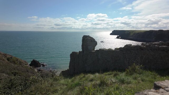 Summertime establishing shot of Barafundle Bay Beach on the Pembrokeshire coast, Wales.