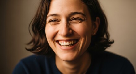 Joyful woman smiling broadly, showing happiness and positivity