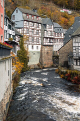 Picturesque Town Monschau with Historical Charm and the Tranquil Rur River in autumn