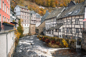 Picturesque Town Monschau with Historical Charm and the Tranquil Rur River in autumn