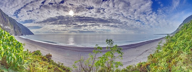Panoramic coastal landscape of Taiwan with cliffs and calm sea