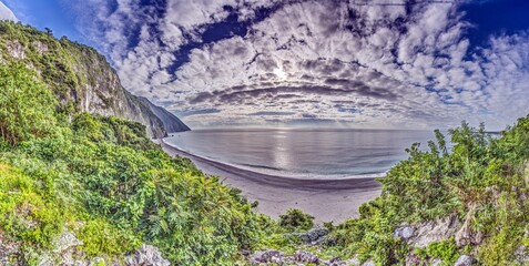 Dramatic Taiwan coastline with steep cliffs and blue sea