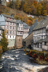 Picturesque Town Monschau with Historical Charm and the Tranquil Rur River in autumn