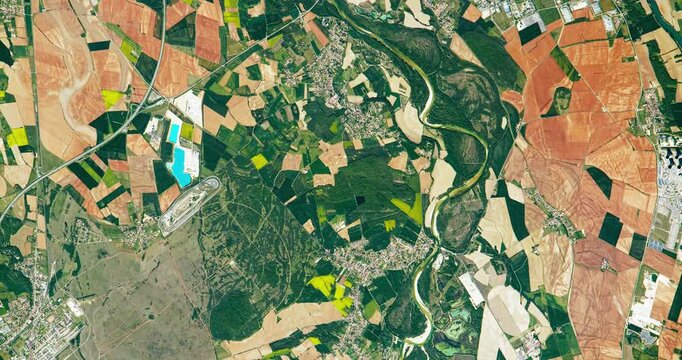 Panoramic top view of fertile land and soil, agricultural district. Camera is moving left and down. Animation based on image by NASA