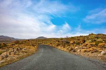 A road with a clear blue sky above it