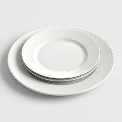Stack of elegant white dinner plates with embossed rim detail
