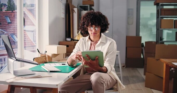 Idea, logistics and tablet with man in office for delivery, distribution or shipping of boxes. App, planning and thinking with employee in supply chain depot for agenda, package tracking or schedule