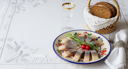Traditional dish of herring served on a colorful plate with bread 
