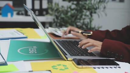 Sustainable business partners discuss renewable energy models and ESG investment strategies for a greener future - Powered by Adobe